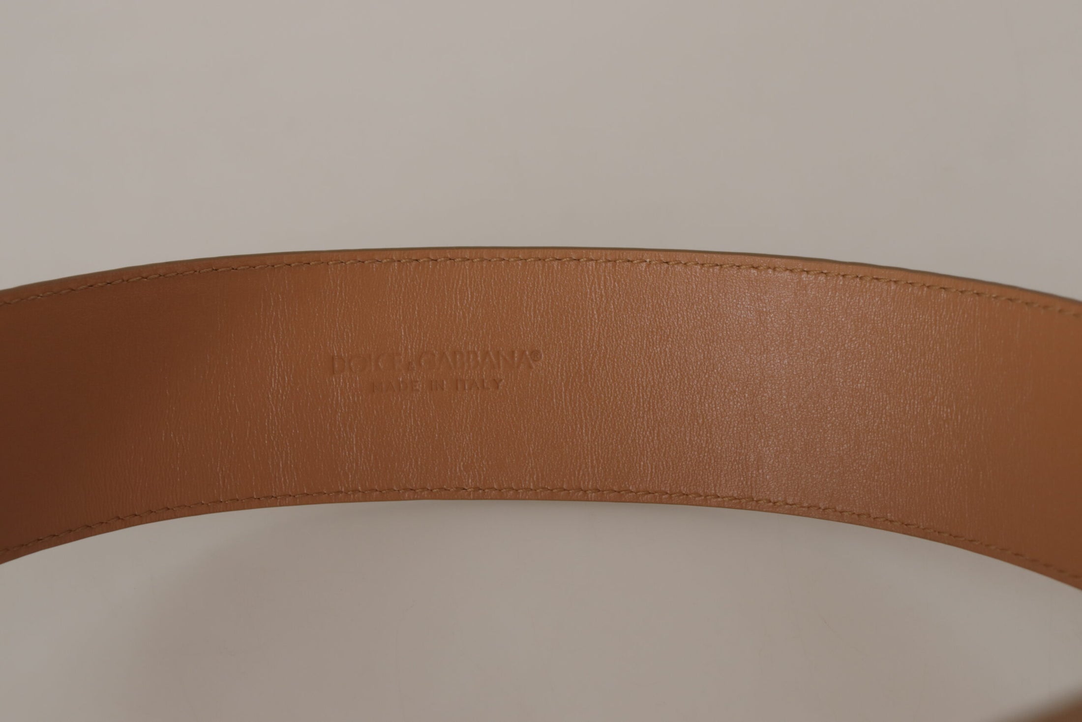 Dolce &amp; Gabbana Elegant beige leather belt with engraved buckle