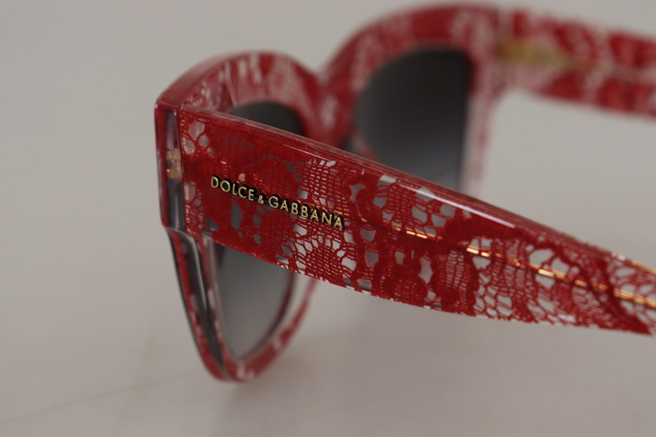 Dolce &amp; Gabbana Elegant red sunglasses with lace decoration